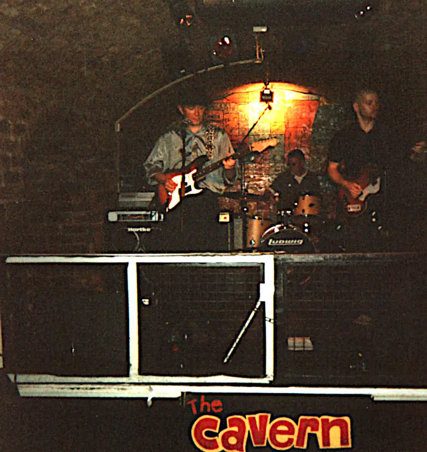 Pete Jorgensen, Johnny Rainford, and Bill Butterworth of Devils River band playing live at the Caven Club Devils River playing live on stage at the Cavern Club Liverpool