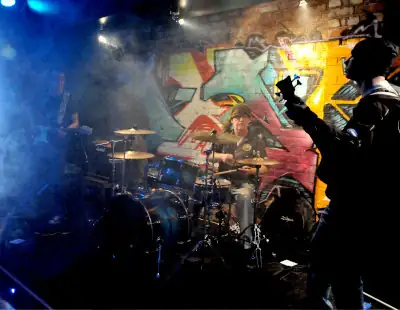 Devils River live at Drakes, Southport, UK Devils River on stage with colourful lighting and smoke viewed from stage right